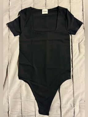 Dynamic Black One-Piece Bodysuit